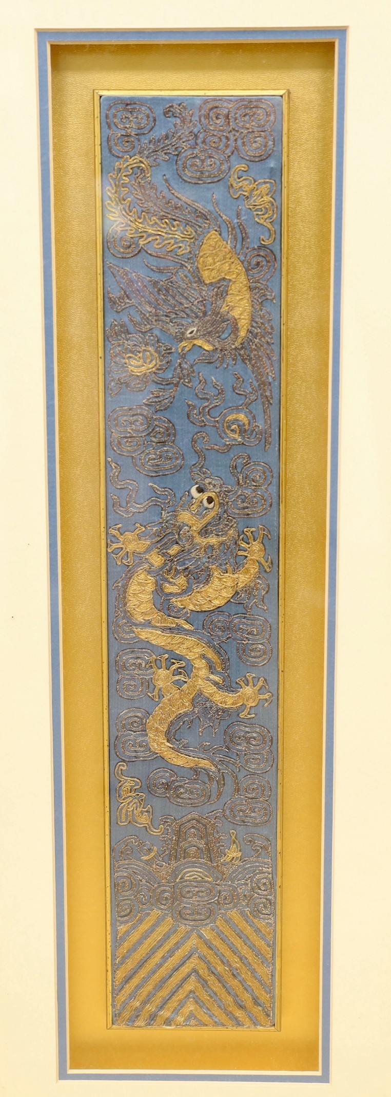 A pair of framed early 20th century Chinese metal thread embroidered ‘dragon’ design sleeve bands, 48x9cms excl frame